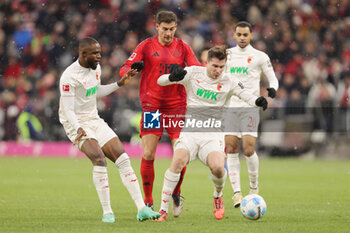 2024-11-22 - Leon Goretzka of Bayern Munich and Elvis Rexhbecaj of Augsburg during the German championship Bundesliga football match between Bayern Munich and Augsburg on 22 November 2024 at Allianz Arena in Munich, Germany - FOOTBALL - GERMAN CHAMP - BAYERN MUNICH V AUGSBURG - GERMAN BUNDESLIGA - SOCCER