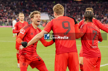 2024-11-22 - Harry Kane of Bayern Munich celebrates his goal 3-0 with Thomas Müller during the German championship Bundesliga football match between Bayern Munich and Augsburg on 22 November 2024 at Allianz Arena in Munich, Germany - FOOTBALL - GERMAN CHAMP - BAYERN MUNICH V AUGSBURG - GERMAN BUNDESLIGA - SOCCER