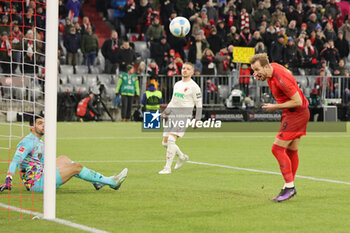 2024-11-22 - Harry Kane of Bayern Munich scores a goal 3-0 during the German championship Bundesliga football match between Bayern Munich and Augsburg on 22 November 2024 at Allianz Arena in Munich, Germany - FOOTBALL - GERMAN CHAMP - BAYERN MUNICH V AUGSBURG - GERMAN BUNDESLIGA - SOCCER