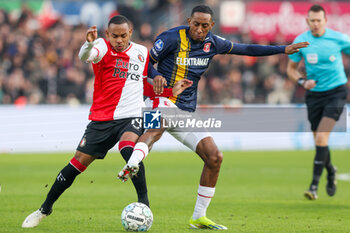 2024-01-28 - Igor Paixao of Feyenoord battles for the ball with Joshua Brenet of FC Twente during the Netherlands championship Eredivisie football match between Feyenoord and FC Twente on January 28, 2024 at Stadion Feyenoord in Rotterdam, Netherlands - FOOTBALL - NETHERLANDS CHAMP - FEYENOORD V TWENTE - NETHERLANDS EREDIVISIE - SOCCER