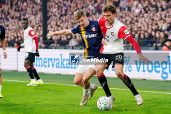 2024-01-28 - Gijs Smal of FC Twente battles for possession with Mats Wieffer of Feyenoord during the Netherlands championship Eredivisie football match between Feyenoord and FC Twente on January 28, 2024 at Stadion Feyenoord in Rotterdam, Netherlands - FOOTBALL - NETHERLANDS CHAMP - FEYENOORD V TWENTE - NETHERLANDS EREDIVISIE - SOCCER