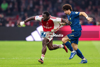 2024-02-03 - Brian Brobbey of Ajax and Andre Ramalho of PSV during the Netherlands championship Eredivisie football match between AFC Ajax and PSV on February 3, 2024 at Johan Cruijff ArenA in Amsterdam, Netherlands - FOOTBALL - NETHERLANDS CHAMP - AJAX V PSV - NETHERLANDS EREDIVISIE - SOCCER