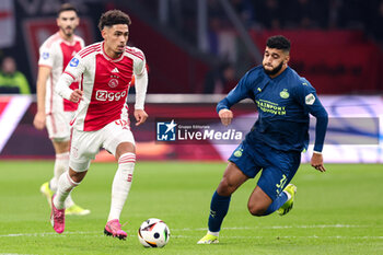 2024-02-03 - Tristan Gooijer of Ajax battles for possession with Ismael Saibari of PSV during the Netherlands championship Eredivisie football match between AFC Ajax and PSV on February 3, 2024 at Johan Cruijff ArenA in Amsterdam, Netherlands - FOOTBALL - NETHERLANDS CHAMP - AJAX V PSV - NETHERLANDS EREDIVISIE - SOCCER