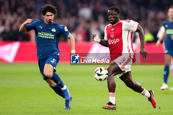 2024-02-03 - Andre Ramalho of PSV battles for possession with Brian Brobbey of Ajax during the Netherlands championship Eredivisie football match between AFC Ajax and PSV on February 3, 2024 at Johan Cruijff ArenA in Amsterdam, Netherlands - FOOTBALL - NETHERLANDS CHAMP - AJAX V PSV - NETHERLANDS EREDIVISIE - SOCCER