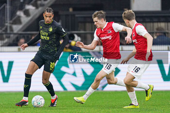 2024-02-04 - Calvin Stengs of Feyenoord, David Moller Wolfe of AZ, Sven Mijnans of AZ during the Netherlands championship Eredivisie football match between AZ and Feyenoord on February 4, 2024 at AFAS Stadion in Alkmaar, Netherlands - FOOTBALL - NETHERLANDS CHAMP - AZ V FEYENOORD - NETHERLANDS EREDIVISIE - SOCCER
