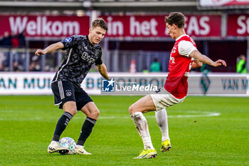 2024-02-25 - Anton Gaaei of AFC Ajax battles for possession with Ruben van Bommel of AZ Alkmaar during the Netherlands championship Eredivisie football match between AZ and AFC Ajax on February 25, 2024 at AFAS Stadion in Alkmaar, Netherlands - FOOTBALL - NETHERLANDS CHAMP - AZ V AJAX - NETHERLANDS EREDIVISIE - SOCCER