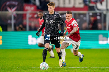 2024-02-25 - Kristian Hlynsson of AFC Ajax and Jordy Clasie of AZ Alkmaar during the Netherlands championship Eredivisie football match between AZ and AFC Ajax on February 25, 2024 at AFAS Stadion in Alkmaar, Netherlands - FOOTBALL - NETHERLANDS CHAMP - AZ V AJAX - NETHERLANDS EREDIVISIE - SOCCER
