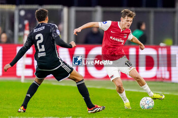 2024-02-25 - David Moller Wolfe of AZ Alkmaar battles for possession with Devyne Rensch of AFC Ajax during the Netherlands championship Eredivisie football match between AZ and AFC Ajax on February 25, 2024 at AFAS Stadion in Alkmaar, Netherlands - FOOTBALL - NETHERLANDS CHAMP - AZ V AJAX - NETHERLANDS EREDIVISIE - SOCCER