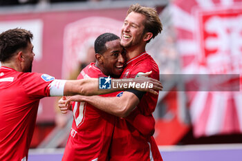 2024-02-25 - Joshua Brenet of FC Twente, Michel Vlap of FC Twente celebrate the third goal during the Netherlands championship Eredivisie football match between FC Twente and Go Ahead Eagles on February 25, 2024 at Grolsch Veste in Enschede, Netherlands - FOOTBALL - NETHERLANDS CHAMP - TWENTE V GO AHEAD EAGLES - NETHERLANDS EREDIVISIE - SOCCER