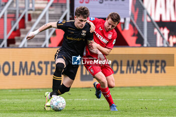 2024-02-25 - Thibo Baeten of Go Ahead Eagles, Mathias Kjolo of FC Twente during the Netherlands championship Eredivisie football match between FC Twente and Go Ahead Eagles on February 25, 2024 at Grolsch Veste in Enschede, Netherlands - FOOTBALL - NETHERLANDS CHAMP - TWENTE V GO AHEAD EAGLES - NETHERLANDS EREDIVISIE - SOCCER