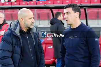 2024-10-19 - Head Coach Maarten Martens of AZ Alkmaar talking with Coach Peter Bosz of PSV during the Netherlands championship, Eredivisie football match between AZ Alkmaar and PSV Eindhoven on October 19, 2024 at AFAS Stadion in Alkmaar, Netherlands - FOOTBALL - NETHERLANDS CHAMP - AZ V PSV - NETHERLANDS EREDIVISIE - SOCCER