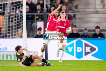 2024-10-19 - Olivier Boscagli of PSV battles for possession with Denso Kasius of AZ Alkmaar during the Netherlands championship, Eredivisie football match between AZ Alkmaar and PSV Eindhoven on October 19, 2024 at AFAS Stadion in Alkmaar, Netherlands - FOOTBALL - NETHERLANDS CHAMP - AZ V PSV - NETHERLANDS EREDIVISIE - SOCCER