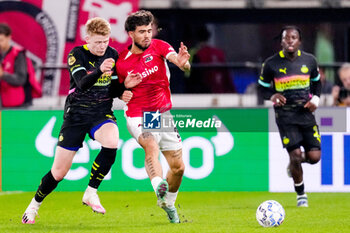 2024-10-19 - Jerdy Schouten of PSV battles for possession with Denso Kasius of AZ Alkmaar during the Netherlands championship, Eredivisie football match between AZ Alkmaar and PSV Eindhoven on October 19, 2024 at AFAS Stadion in Alkmaar, Netherlands - FOOTBALL - NETHERLANDS CHAMP - AZ V PSV - NETHERLANDS EREDIVISIE - SOCCER