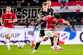 2024-10-19 - Troy Parrott of AZ Alkmaar battles for possession with Jerdy Schouten of PSV during the Netherlands championship, Eredivisie football match between AZ Alkmaar and PSV Eindhoven on October 19, 2024 at AFAS Stadion in Alkmaar, Netherlands - FOOTBALL - NETHERLANDS CHAMP - AZ V PSV - NETHERLANDS EREDIVISIE - SOCCER