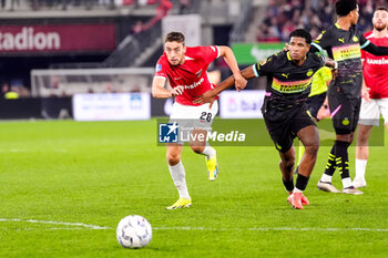 2024-10-19 - Zico Buurmeester of AZ Alkmaar battles for possession with Ryan Flamingo of PSV during the Netherlands championship, Eredivisie football match between AZ Alkmaar and PSV Eindhoven on October 19, 2024 at AFAS Stadion in Alkmaar, Netherlands - FOOTBALL - NETHERLANDS CHAMP - AZ V PSV - NETHERLANDS EREDIVISIE - SOCCER