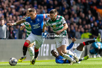 2024-04-07 - James Tavernier of Rangers FC and Greg Taylor of Celtic FC during the Scottish championship, Cinch Premiership football match between Rangers and Celtic on 7 April 2024 at Ibrox in Glasgow, Scotland - FOOTBALL - SCOTTISH CHAMP - RANGERS V CELTIC - SCOTTISH PREMIERSHIP - SOCCER