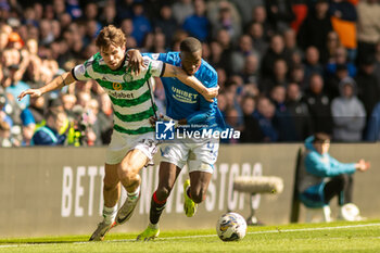 2024-04-07 - Matt O'Riley of Celtic FC and Mohamed Diomande of Rangers FC during the Scottish championship, Cinch Premiership football match between Rangers and Celtic on 7 April 2024 at Ibrox in Glasgow, Scotland - FOOTBALL - SCOTTISH CHAMP - RANGERS V CELTIC - SCOTTISH PREMIERSHIP - SOCCER
