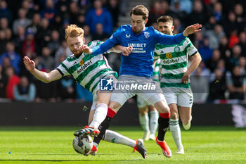 2024-04-07 - Liam Scales of Celtic FC and Scott Wright of Rangers FC during the Scottish championship, Cinch Premiership football match between Rangers and Celtic on 7 April 2024 at Ibrox in Glasgow, Scotland - FOOTBALL - SCOTTISH CHAMP - RANGERS V CELTIC - SCOTTISH PREMIERSHIP - SOCCER