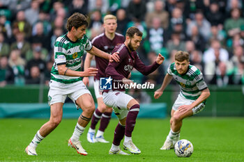 04/05/2024 - Jorge Grant of Hearts holds off Matt O'Riley of Celtic during the Scottish championship Premiership football match between Celtic and Heart of Midlothian on 4 May 2024 at Celtic Park IN Glasgow, Scotland - FOOTBALL - SCOTTISH CHAMP - CELTIC V HEART OF MIDLOTHIAN - SCOTTISH PREMIERSHIP - CALCIO