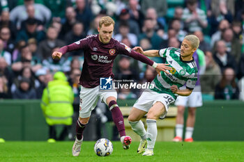 04/05/2024 - Nathaniel Atkinson of Hearts holds off Daizen Maeda of Celtic during the Scottish championship Premiership football match between Celtic and Heart of Midlothian on 4 May 2024 at Celtic Park IN Glasgow, Scotland - FOOTBALL - SCOTTISH CHAMP - CELTIC V HEART OF MIDLOTHIAN - SCOTTISH PREMIERSHIP - CALCIO