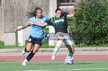 2024-09-20 - Samantha Fisher of US Sassuolo Femminile competes for the ball with Manuele sciabica of Napoli Femminile during the Soccer- Italian Serie A Women between Napoli Femminile vs US Sassuolo at Arena Giuseppe Piccolo Stadium - NAPOLI FEMMINILE VS US SASSUOLO - ITALIAN SERIE A WOMEN - SOCCER