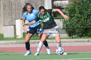 2024-09-20 - Samantha Fisher of US Sassuolo Femminile competes for the ball with Manuele sciabica of Napoli Femminile during the Soccer- Italian Serie A Women between Napoli Femminile vs US Sassuolo at Arena Giuseppe Piccolo Stadium - NAPOLI FEMMINILE VS US SASSUOLO - ITALIAN SERIE A WOMEN - SOCCER