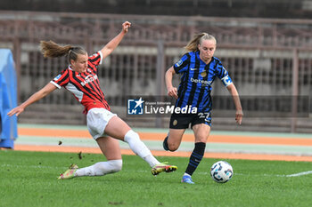 2024-09-22 - #23 Julie Piga of Milan Women contrast #27 Henrietta Csizar of Inter Women in action during Serie A Ebay Femminile 24/25 match between FC Inter Women and AC Milan Wome at Arena Civica Ernesto Breda, Milano - INTER - FC INTERNAZIONALE VS AC MILAN - ITALIAN SERIE A WOMEN - SOCCER