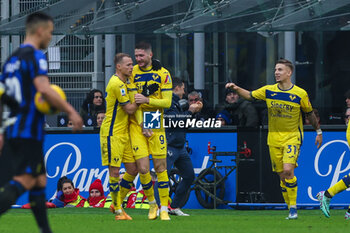 2024-01-06 - Thomas Henry of Hellas Verona FC celebrates with his teammates after scoring a goal during Serie A 2023/24 football match between FC Internazionale and Hellas Verona at Giuseppe Meazza Stadium, Milan, Italy on January 06, 2024 - INTER - FC INTERNAZIONALE VS HELLAS VERONA FC - ITALIAN SERIE A - SOCCER