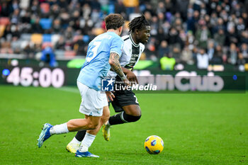 2024-01-07 - Udinese's Festy Ebosele in action against Lazio's Luca Pellegrini - UDINESE CALCIO VS SS LAZIO - ITALIAN SERIE A - SOCCER