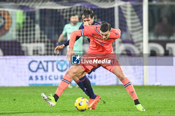 2024-01-14 - Udinese's Lorenzo Lucca fights for the ball against Fiorentina's Luca Ranieri - ACF FIORENTINA VS UDINESE CALCIO - ITALIAN SERIE A - SOCCER