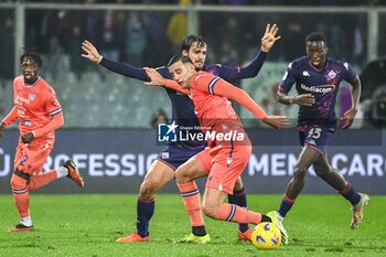 2024-01-14 - Udinese's Lorenzo Lucca fights for the ball against Fiorentina's Luca Ranieri - ACF FIORENTINA VS UDINESE CALCIO - ITALIAN SERIE A - SOCCER