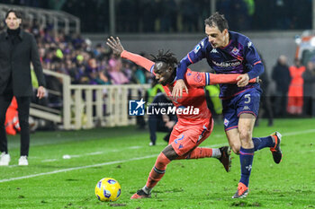 2024-01-14 - Udinese's Festy Ebosele thwarted by Fiorentina's Giacomo Bonaventura - ACF FIORENTINA VS UDINESE CALCIO - ITALIAN SERIE A - SOCCER