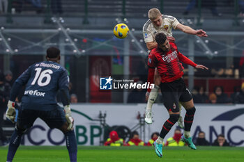 2024-01-14 - Rasmus Kristensen of AS Roma seen in action with Theo Hernandez of AC Milan during Serie A 2023/24 football match between AC Milan and AS Roma at San Siro Stadium, Milan, Italy on January 14, 2024 - AC MILAN VS AS ROMA - ITALIAN SERIE A - SOCCER