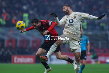 2024-01-14 - Davide Calabria of AC Milan competes for the ball with Leonardo Spinazzola of AS Roma during Serie A 2023/24 football match between AC Milan and AS Roma at San Siro Stadium, Milan, Italy on January 14, 2024 - AC MILAN VS AS ROMA - ITALIAN SERIE A - SOCCER