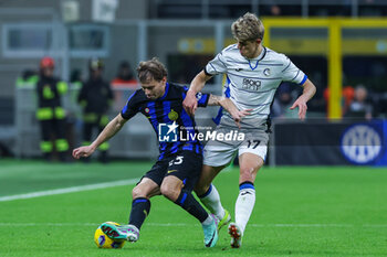 2024-02-28 - Nicolo Barella of FC Internazionale (L) competes for the ball with Charles De Ketelaere of Atalanta BC (R) during Serie A 2023/24 football match between FC Internazionale and Atalanta BC at Giuseppe Meazza Stadium, Milan, Italy on February 28, 2024 - INTER - FC INTERNAZIONALE VS ATALANTA BC - ITALIAN SERIE A - SOCCER