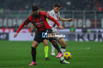 2024-01-27 - Olivier Giroud of AC Milan competes for the ball with Remo Freuler of Bologna FC during Serie A 2023/24 football match between AC Milan and Bologna FC at San Siro Stadium, Milan, Italy on January 27, 2024 - AC MILAN VS BOLOGNA FC - ITALIAN SERIE A - SOCCER