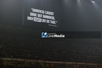 2024-01-27 - A quote by by Martin Luther King is displayed on a giant screen at minute 16 during a temporary suspension of the match in support of AC Milan's French goalkeeper #16 Mike Maignan, who was victim of racist abuse during Serie A 2023/24 football match between AC Milan and Bologna FC at San Siro Stadium, Milan, Italy on January 27, 2024 - AC MILAN VS BOLOGNA FC - ITALIAN SERIE A - SOCCER