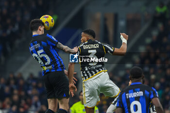2024-02-04 - Alessandro Bastoni of FC Internazionale seen in action with Gleison Bremer of Juventus FC during Serie A 2023/24 football match between FC Internazionale and Juventus FC at Giuseppe Meazza Stadium, Milan, Italy on February 04, 2024 - INTER - FC INTERNAZIONALE VS JUVENTUS FC - ITALIAN SERIE A - SOCCER