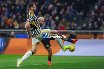 2024-02-04 - Federico Dimarco of FC Internazionale competes for the ball with Federico Gatti of Juventus FC during Serie A 2023/24 football match between FC Internazionale and Juventus FC at Giuseppe Meazza Stadium, Milan, Italy on February 04, 2024 - INTER - FC INTERNAZIONALE VS JUVENTUS FC - ITALIAN SERIE A - SOCCER