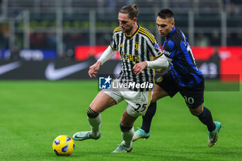 2024-02-04 - Adrien Rabiot of Juventus FC competes for the ball with Lautaro Martinez of FC Internazionale during Serie A 2023/24 football match between FC Internazionale and Juventus FC at Giuseppe Meazza Stadium, Milan, Italy on February 04, 2024 - INTER - FC INTERNAZIONALE VS JUVENTUS FC - ITALIAN SERIE A - SOCCER