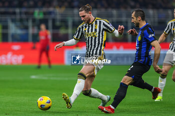 2024-02-04 - Adrien Rabiot of Juventus FC competes for the ball with Henrikh Mkhitaryan of FC Internazionale during Serie A 2023/24 football match between FC Internazionale and Juventus FC at Giuseppe Meazza Stadium, Milan, Italy on February 04, 2024 - INTER - FC INTERNAZIONALE VS JUVENTUS FC - ITALIAN SERIE A - SOCCER