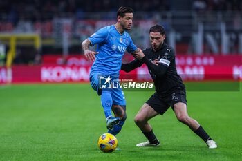 2024-02-11 - Pasquale Mazzocchi of SSC Napoli competes for the ball with Davide Calabria of AC Milan during Serie A 2023/24 football match between AC Milan and SSC Napoli at San Siro Stadium, Milan, Italy on February 11, 2024 - AC MILAN VS SSC NAPOLI - ITALIAN SERIE A - SOCCER
