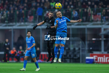 2024-02-11 - Stanislav Lobotka of SSC Napoli competes for the ball with Ismael Bennacer of AC Milan during Serie A 2023/24 football match between AC Milan and SSC Napoli at San Siro Stadium, Milan, Italy on February 11, 2024 - AC MILAN VS SSC NAPOLI - ITALIAN SERIE A - SOCCER