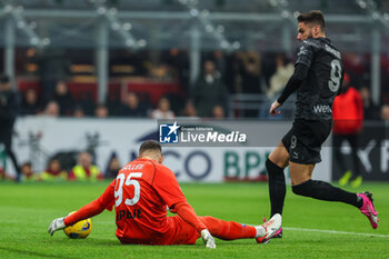 2024-02-11 - Olivier Giroud of AC Milan seen in action with Pierluigi Gollini of SSC Napoli during Serie A 2023/24 football match between AC Milan and SSC Napoli at San Siro Stadium, Milan, Italy on February 11, 2024 - AC MILAN VS SSC NAPOLI - ITALIAN SERIE A - SOCCER