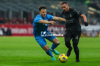 2024-02-11 - Ismael Bennacer of AC Milan competes for the ball with Amir Rrahmani of SSC Napoli during Serie A 2023/24 football match between AC Milan and SSC Napoli at San Siro Stadium, Milan, Italy on February 11, 2024 - AC MILAN VS SSC NAPOLI - ITALIAN SERIE A - SOCCER