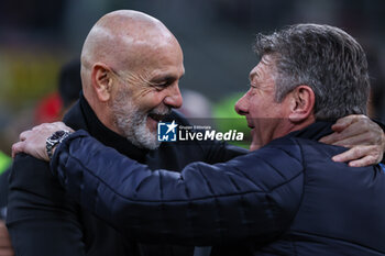 2024-02-11 - Stefano Pioli Head Coach of AC Milan smiling with Walter Mazzarri Head Coach of SSC Napoli  during Serie A 2023/24 football match between AC Milan and SSC Napoli at San Siro Stadium, Milan, Italy on February 11, 2024 - AC MILAN VS SSC NAPOLI - ITALIAN SERIE A - SOCCER