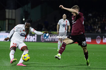 2024-02-24 - Monza’s French midfielder Warren Bondo challenges for the ball with Salernitana's Croatian midfielder Toma Basic during the Serie A football match between Unione Sportiva Salernitana vs Monza at the Arechi Stadium in Salerno on February 24, 2024. - US SALERNITANA VS AC MONZA - ITALIAN SERIE A - SOCCER