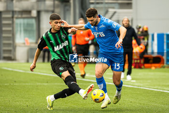 2024-02-24 - Cristian Volpato (Sassuolo) and Liberato Cacace (Empoli) - US SASSUOLO VS EMPOLI FC - ITALIAN SERIE A - SOCCER