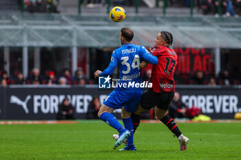 2024-03-10 - Noah Okafor of AC Milan competes for the ball with Ardian Ismajli of Empoli FC during Serie A 2023/24 football match between AC Milan and Empoli FC at San Siro Stadium, Milan, Italy on March 10, 2024 - AC MILAN VS EMPOLI FC - ITALIAN SERIE A - SOCCER