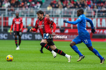 2024-03-10 - Theo Hernandez of AC Milan seen in action with Emmanuel Gyasi of Empoli FC during Serie A 2023/24 football match between AC Milan and Empoli FC at San Siro Stadium, Milan, Italy on March 10, 2024 - AC MILAN VS EMPOLI FC - ITALIAN SERIE A - SOCCER